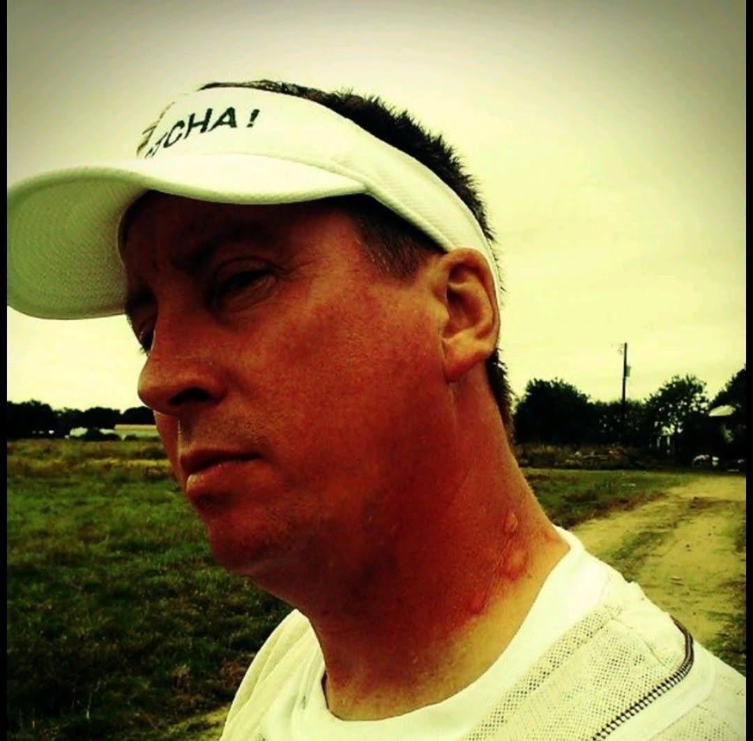 Claude Griffin, Founder of Gotcha Pest Control, wearing a branded visor in the field
